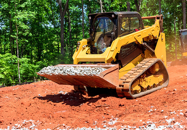 Skid Loader with Bucket Attachment